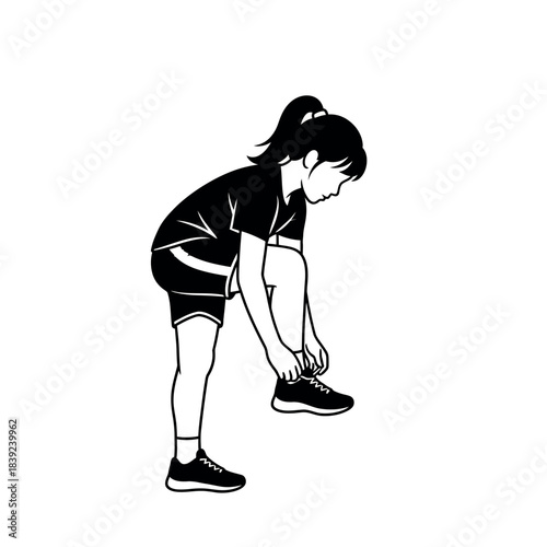 Young girl tying her shoelaces before playing sports.