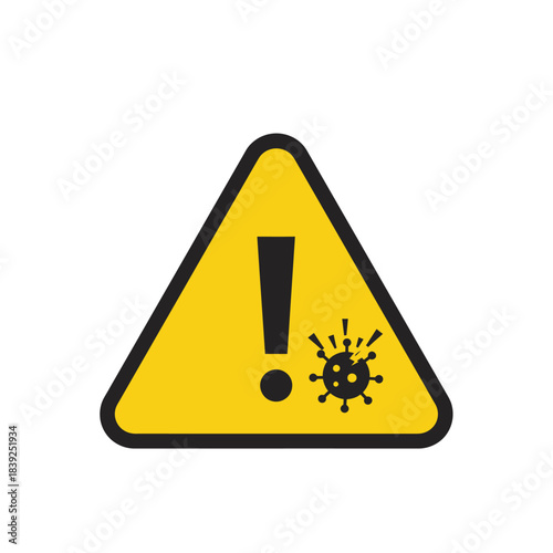 A prominent yellow triangular warning sign alerts individuals to potential viral hazards, emphasizing the critical need for health precautions and awareness during a pandemic.