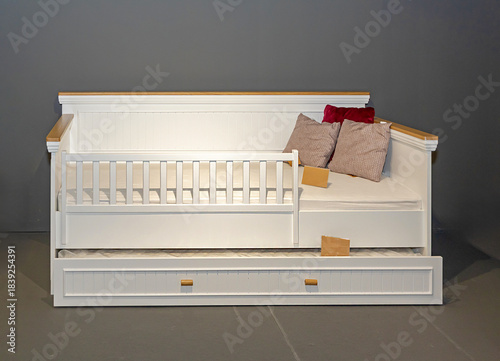 Murphy bed with two mattresses inside living room interior