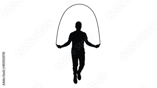Silhouette of a person jumping rope in a dynamic pose
