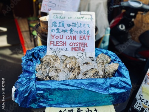 Oyster hut with Japanese oysters on ice at Tsukiji Fish Market in Tokyo, Japan.