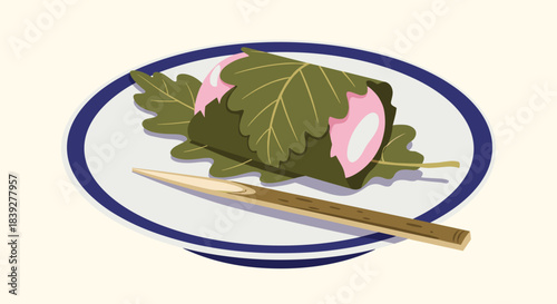 Japanese sakura mochi, a pink rice cake filled with red bean paste and wrapped in an oak leaf, served on a plate with chopsticks.