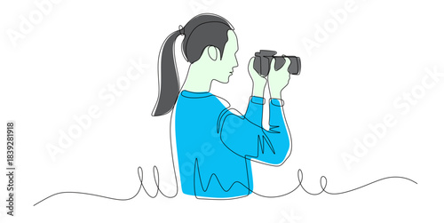 Continuous line art of a woman working as a professional photographer taking pictures with a camera in her hand. Vector illustration with beautiful colors.