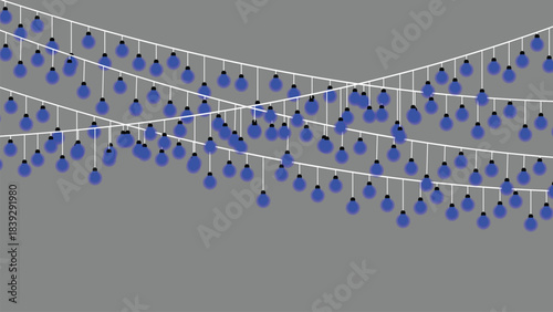 Strings of blue christmas lights hanging against a gray background