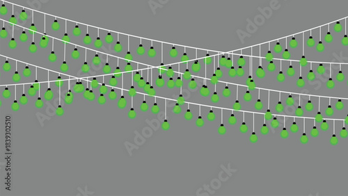 Green string lights hanging on wires against a gray background