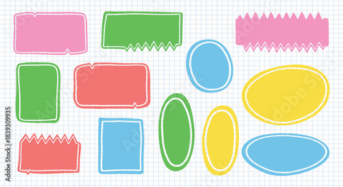 Collection of colorful hand drawn doodle labels and text boxes with rough edges set against a light blue grid paper background for notes