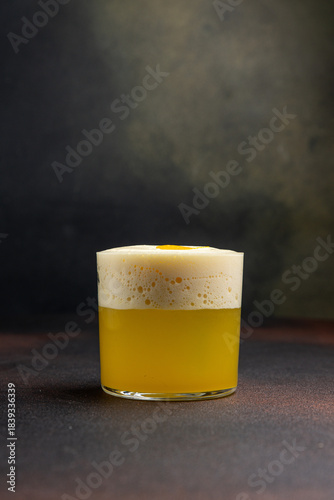 A delicious alcoholic cocktail at the bar. The bartender prepares cocktails