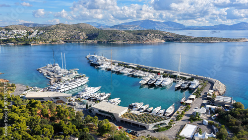 Aerial drone photo of amazing recently renovated Astir Marina with luxury yachts and sail boats  in paradise Peninsula of Vouliagmeni, Athens Riviera, Attica, Greece