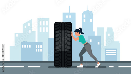 Woman exercising by pushing tire in urban setting with skyline background