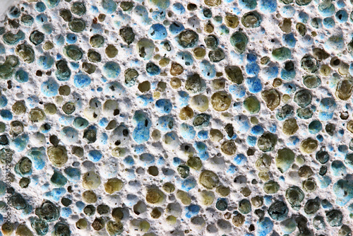 Macro of Pumice Stone Surface with Blue and Green Bits.