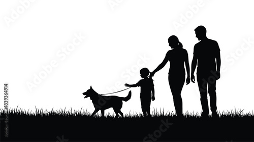 Silhouette of a family walking with their dog at sunset