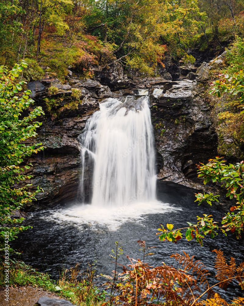 Obraz premium Portrait of the Falls of Falloch, situated in the north of Loch Lomond and The Trossachs National Park, Falls of Falloch is a beautiful waterfall just 3 miles from the village of Crianlarich