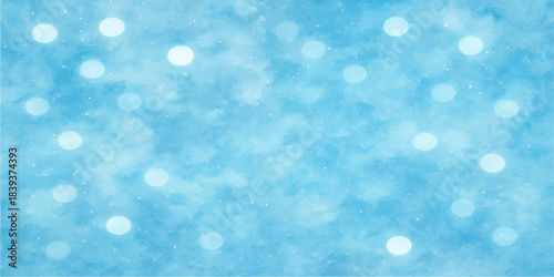 Bright blue bokeh background with defocused Christmas lights and winter snow patterns