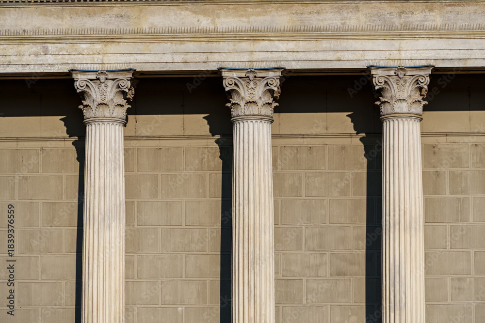 Naklejka premium Columns and wall of an old building as an abstract background, architectural details