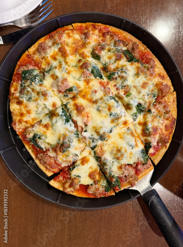 Pizza Served on a Table in a Bar With Drinks in a Casual Setting During the Evening