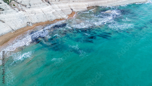 Fototapeta Naklejka Na Ścianę i Meble -  scala dei turchi Beautiful white beach from above drone shot pretty blue ocean sea 