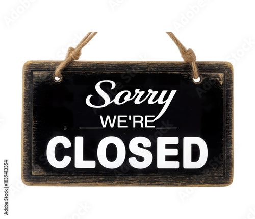 Closed Sign: A rustic sign boldly displays a message of temporary closure, indicating unavailability for business with its concise and clear declaration.