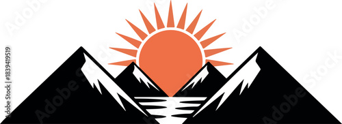 Sunrise over snow-capped mountains and tranquil water reflecting the sun