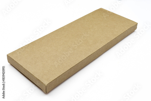 Thin brown blank paper box isolated on white background. rectangle cardboard mockup case