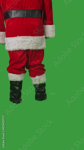 Santa Claus walking on a green chroma key background