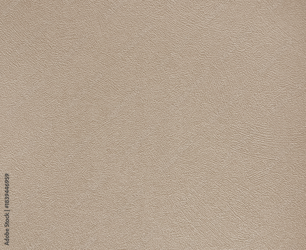 Fototapeta premium Decorative peach or beige textured paint on a surface. Random limestone peach beige color washed paint with grunge, and dirt pattern. Seamless background texture. 