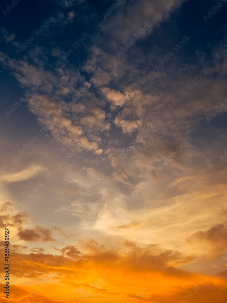 Obraz premium Orange and Blue Sky with Clouds