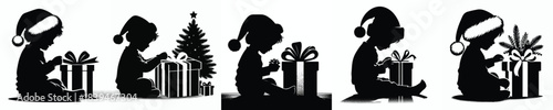 vector silhouette of a little boy opening a Christmas present