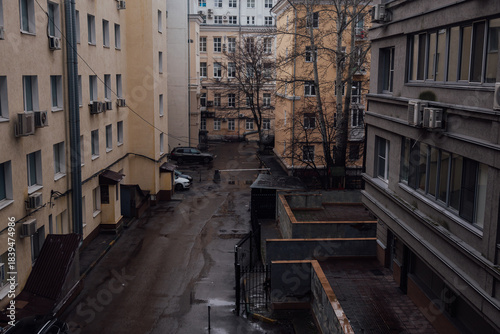 A city street on a cold cloudy rainy day