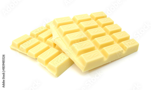 Yellow chocolate pieces isolated on a white background
