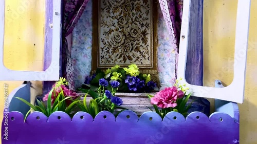 Sunlit flower arrangement against rustic cottage background