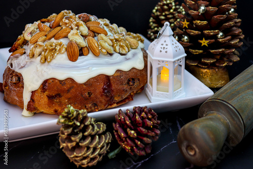 Pan Dulce and pine cones with lantern in christmas dark food style decoration in Argentina