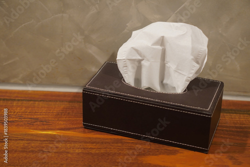 top view Tissue paper in a rectangular box, brown leather, placed on a wooden shelf, tiled wall background, object, decor, decoration, fashion, copy space