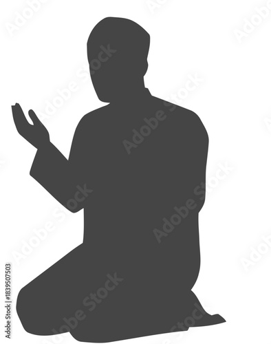 Silhouette of a Muslim Man Kneeling in Prayer