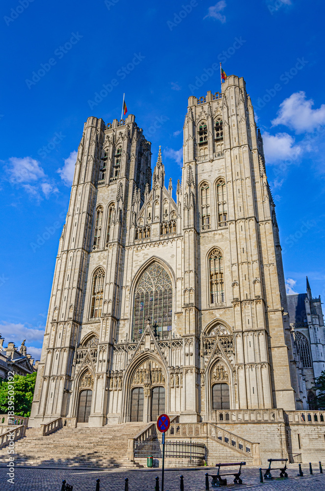 Fototapeta premium The Cathedral of St. Michael and St. Gudula medieval Roman Catholic cathedral Brabantine Gothic architecture style building with bell towers in Brussels city historical center, vertical view, Belgium