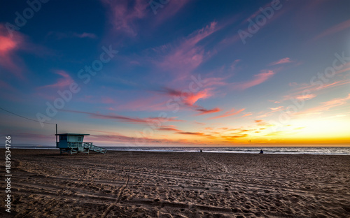 Famous lifeguard tower in Santa Monica beach at sunset