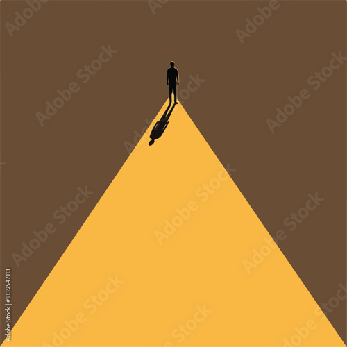 Man standing at the top of a bright illuminated path