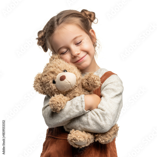 Young Girl Holds a Teddy Bear While Smiling in a Bright Setting