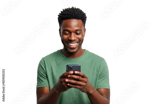 A smiling young black man wearing a green t shirt holding a smartphone and looking at the screen with joy isolated on transparent background
