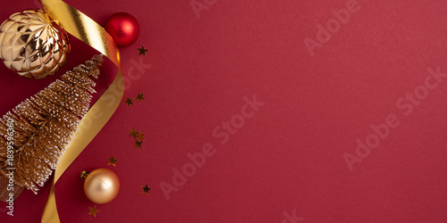 Golden Christmas Tree with Gold Ribbons and Ornaments on Red Background