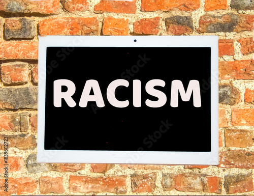 the words racism on a digital tablet