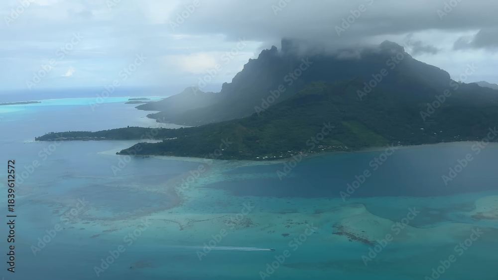Obraz premium Luxury resort photo of French Polynesia tropical paradise island Fakarava with palm trees. Photography with ocean, mountain, sky with clouds.
