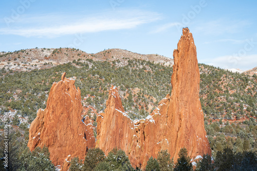 Cathedral Spires red rock formation dusted with snow at Garden of the Gods Park in Colorado Springs, Colorado.