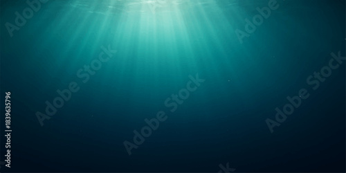 Deep blue underwater ocean scene with sun rays bursting through the water