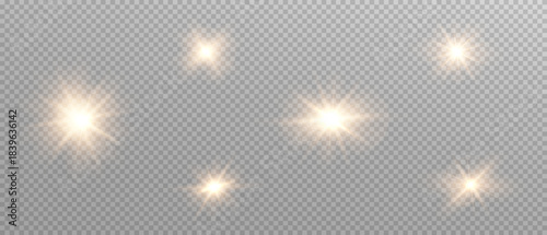 Golden sparkles create a shimmering starburst effect. Light particles gently dispersed, creating a magical, festive shimmer on a transparent background. 