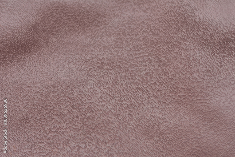 Fototapeta premium Light pink leather texture background. Powdery, pastel surface. Copy space, top view.