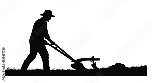 A silhouette of a farmer tilling the land with a manual plow