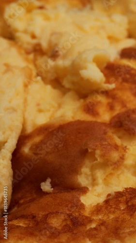 cooked egg omelette, rotation in circle. healthy high-protein food, Turning. vertical video. natural cooking dish