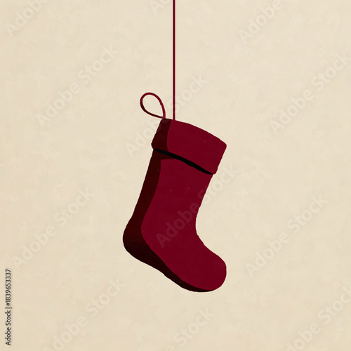 Maroon Christmas Stocking hangs against a beige backdrop, anticipating festive gifts

