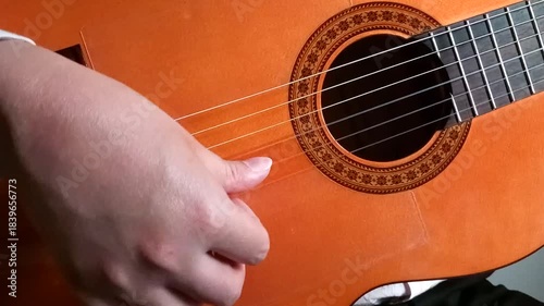 Man playing fast picado with guitar - close up 