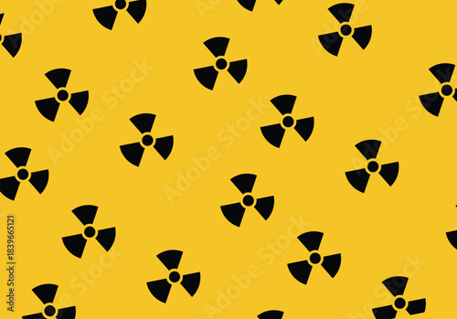 Radiation warning symbol seamless pattern in black on yellow background